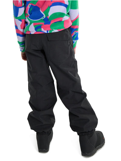 Burtonin mustat lasten Melter Plus 2 L -lumilautailuhousut lapsen päällä takaa kuvattuna lähikuvassa