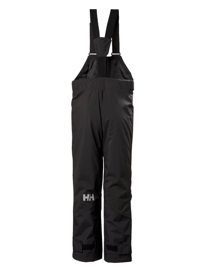 Helly Hansenin mustat lasten ja nuorten korkeavyötäröiset Bib pants -lasketteluhousut takaa kuvattuna.