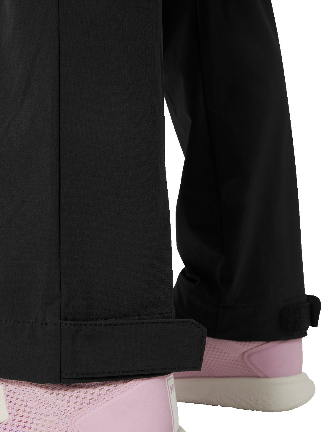 Helly Hansenin nuorten Loen softshell-housut värissä ebony lähikuvassa lahkeiden säätömekanismi