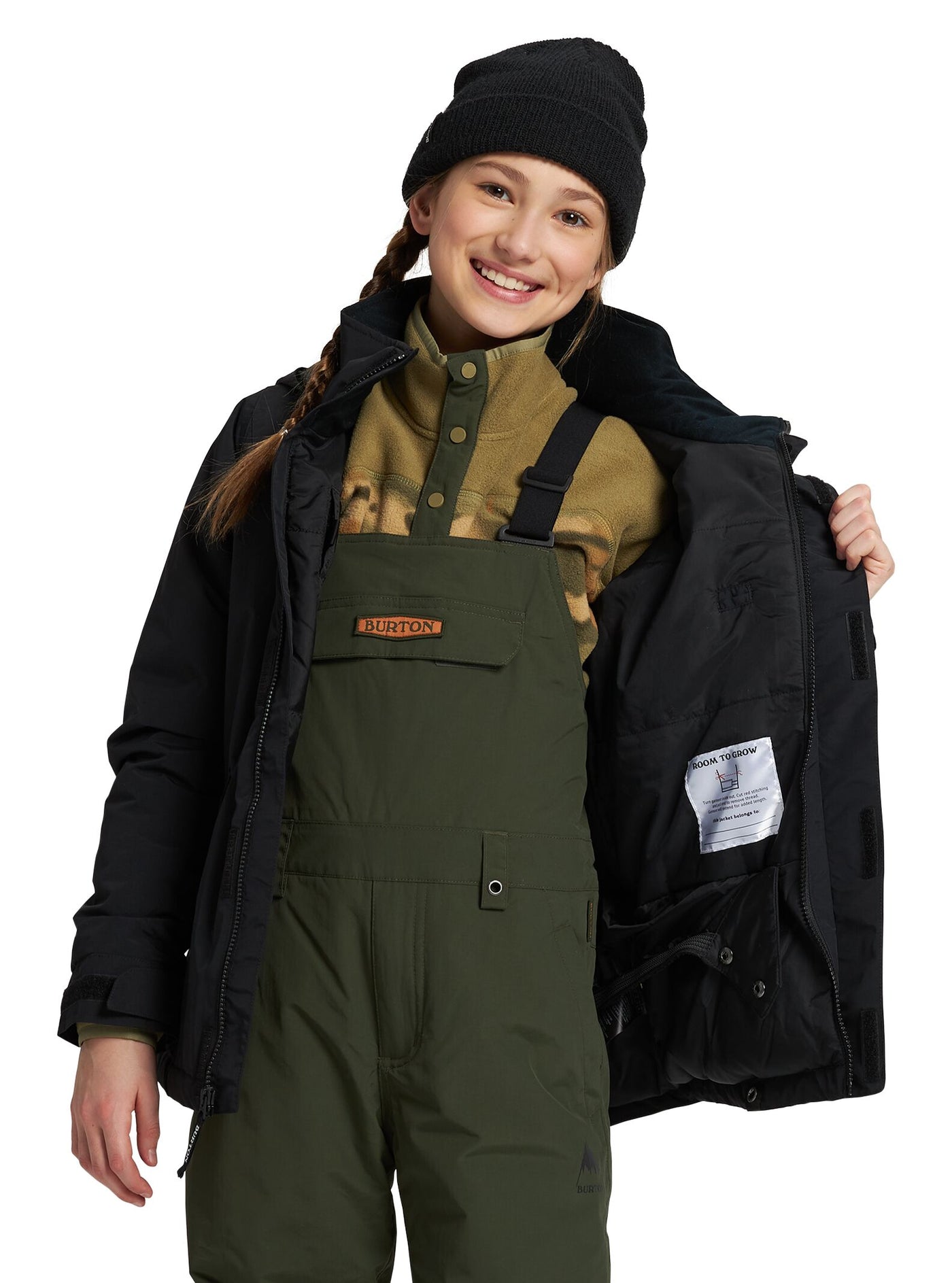 Burtonin Elodie musta lumilautailutakki tytön päällä joka näyttää takin vuorta