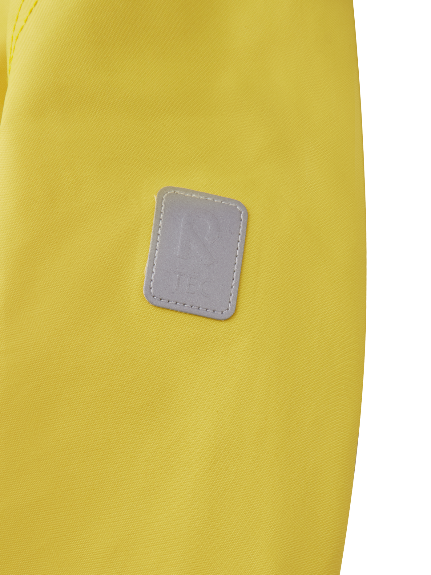 Reima Soutu lasten Reimatec takki värissä Maize Yellow lähikuva R-logosta